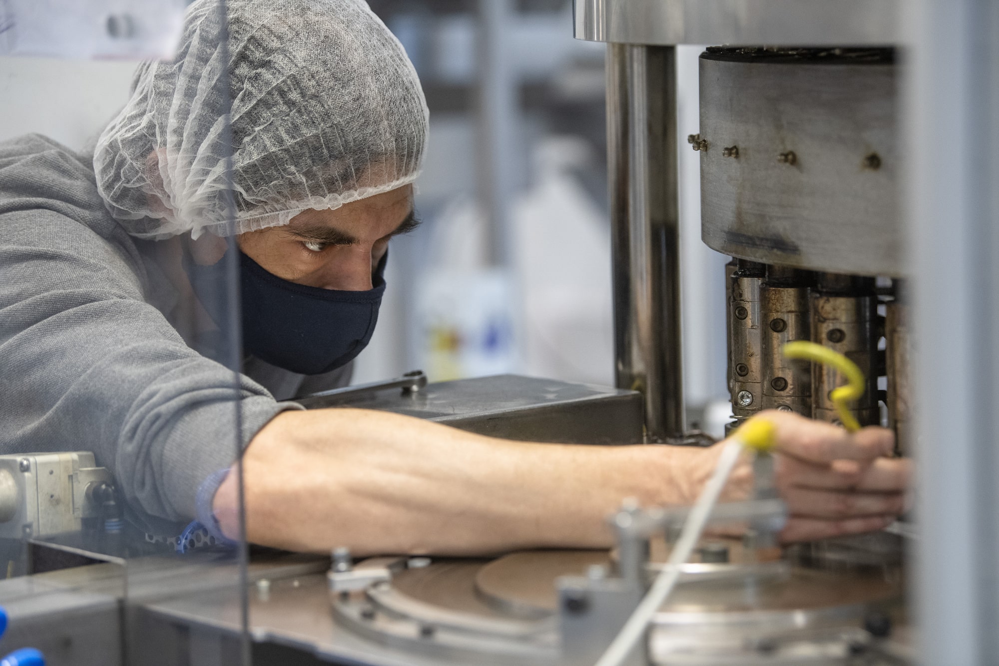 technician on Flip-Off assembly line